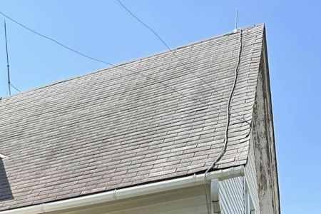 How Winter Damages Roofs in Central Illinois (And Why Spring Roof Cleaning Matters)